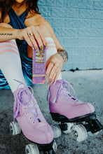 Load image into Gallery viewer, girl wearing pastel rolle rskates and high socks with stripes with pastel pink and brown nails