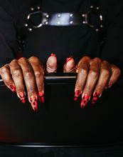 Load image into Gallery viewer, guy wearing press on nails that are red and black with silver metal pieces
