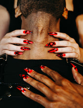 Load image into Gallery viewer, guy being choked by girl and both are wearing red press on nails with black leather chokers