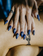 Load image into Gallery viewer, hands wearing the celestial press on nails by Rave Nailz with gold astrological symbols