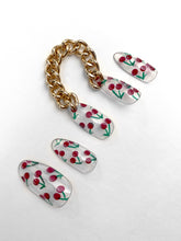 Load image into Gallery viewer, clear cherry press on nails with a gold chain attached to the accent nails