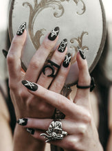 Load image into Gallery viewer, hands holding a vintage mirror wearing wiccan matte black press on nails with witchy symbols and goat heads