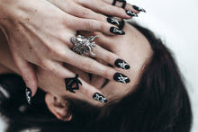 Load image into Gallery viewer, girl with black hair with hands over face wearing goat head ring and satanic matte black stiletto fake nails