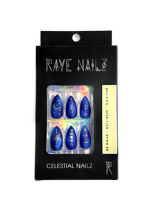 box of navy blue stiletto press on nails with gold celestial designs